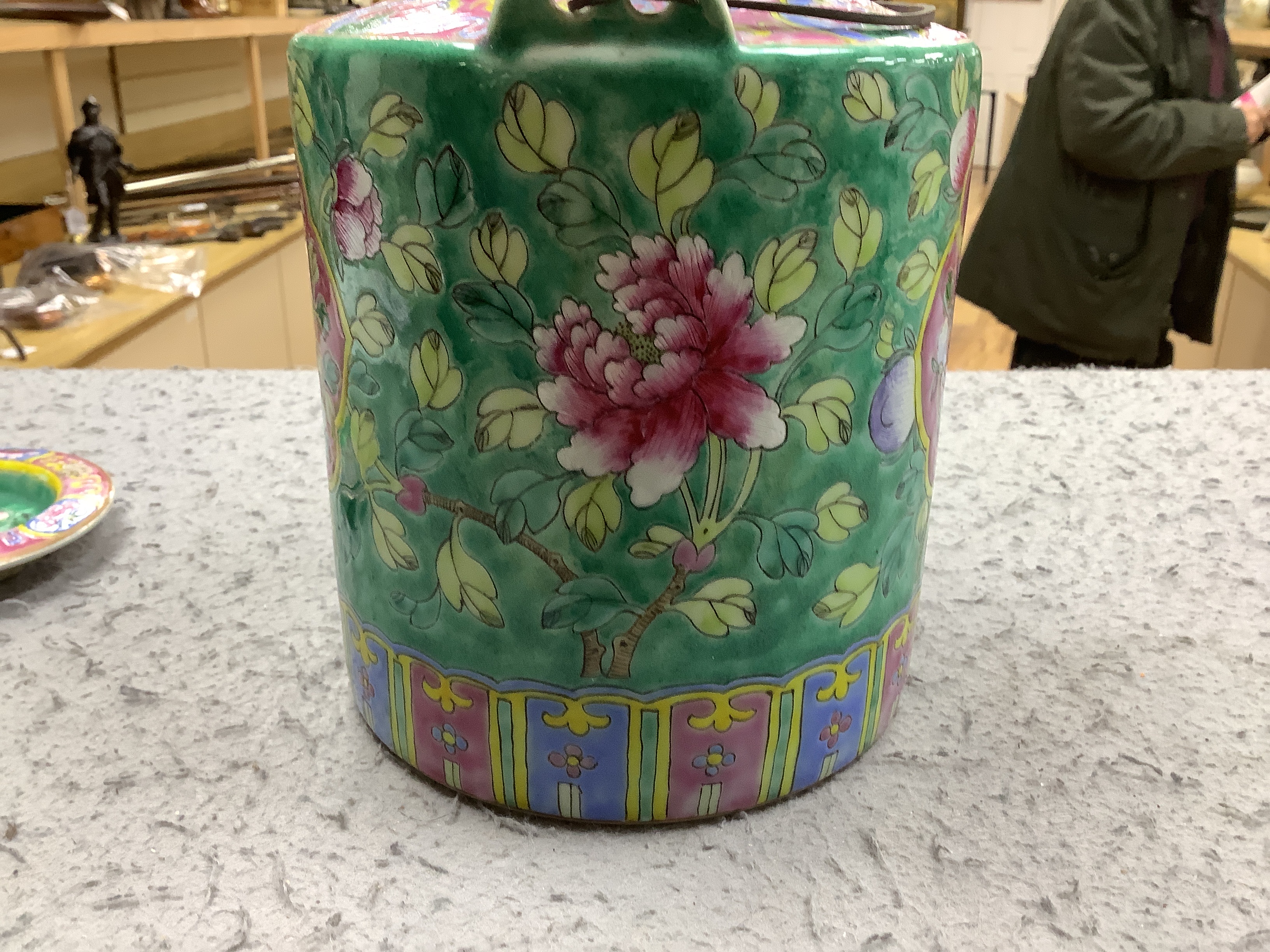 A Chinese Straits enamelled porcelain teapot and cover and seven similar tea bowls, Guangxu period and a pillow, teapot 18cm high including cover